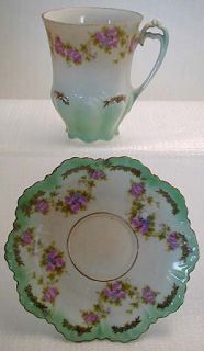COLORS The set is bone china white with light turquoise green, pinks